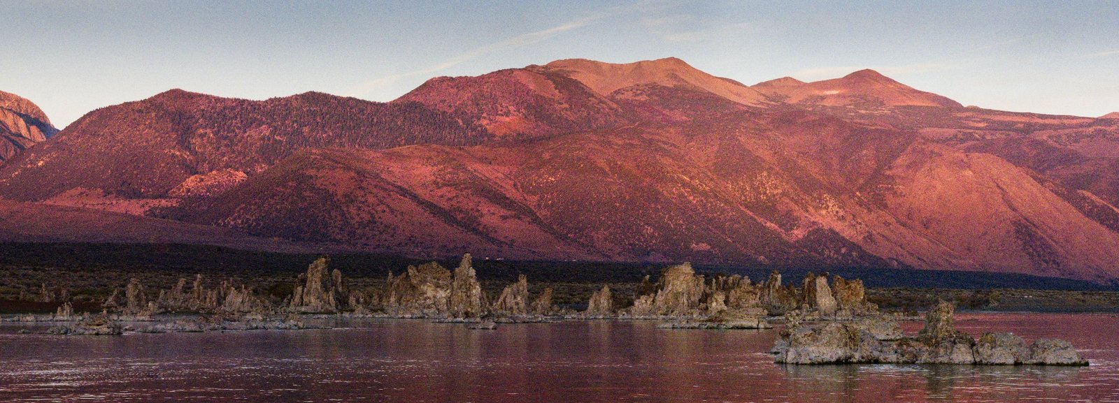 A panorama of Mono Lake and the tufa formations in the early morning alpenglow.